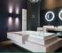 A contemporary bathroom with illuminated mirrors and soft lighting