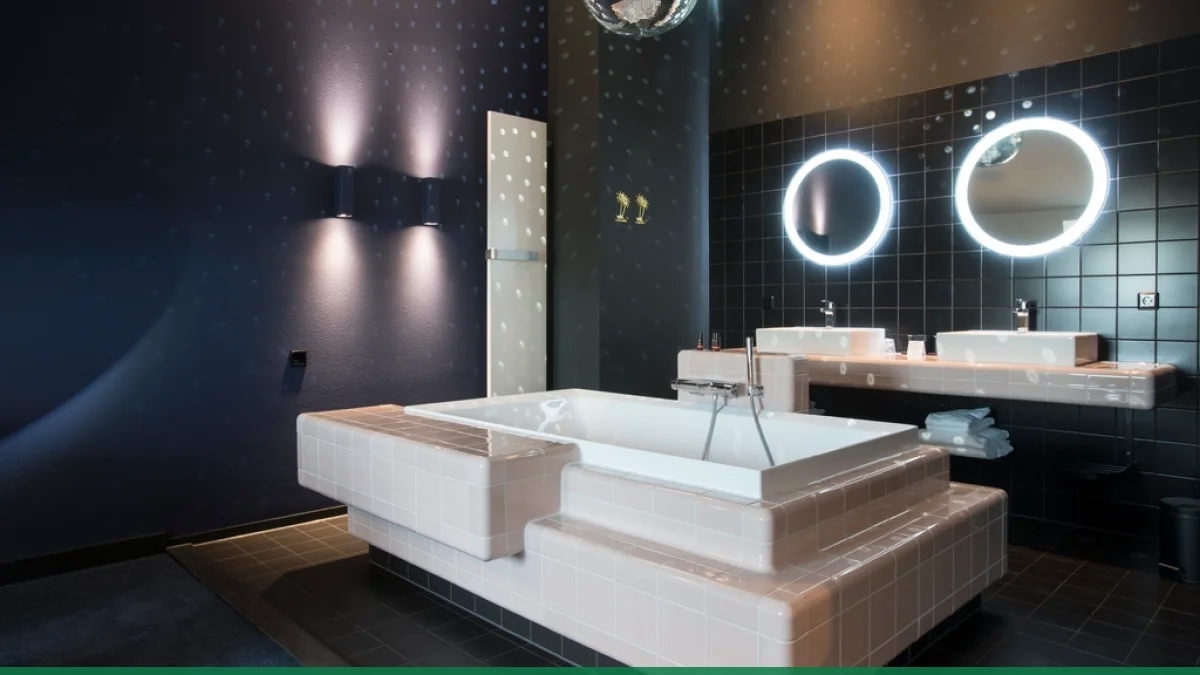 A contemporary bathroom with illuminated mirrors and soft lighting