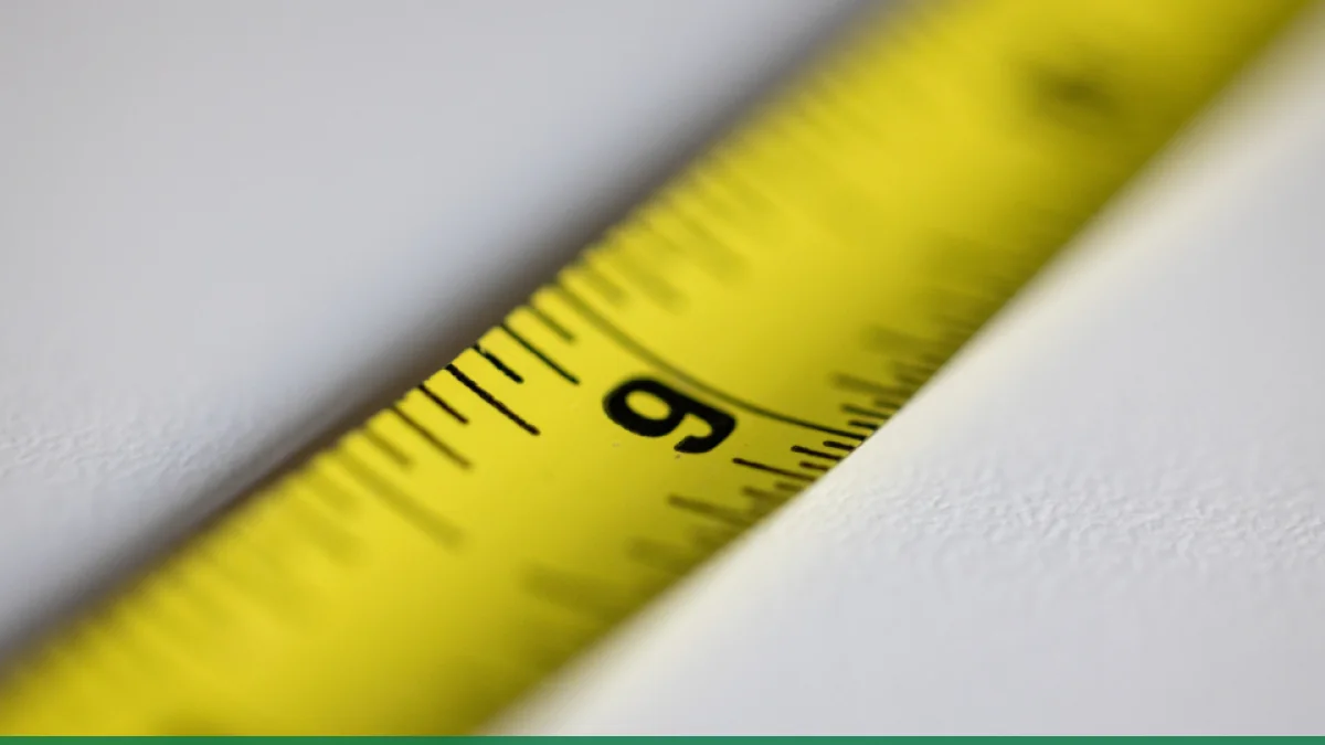 A close-up of a measuring tape used for checking product sizes
