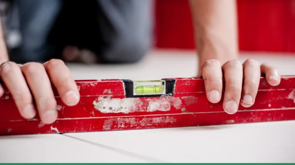 A spirit level being used during home renovation planning